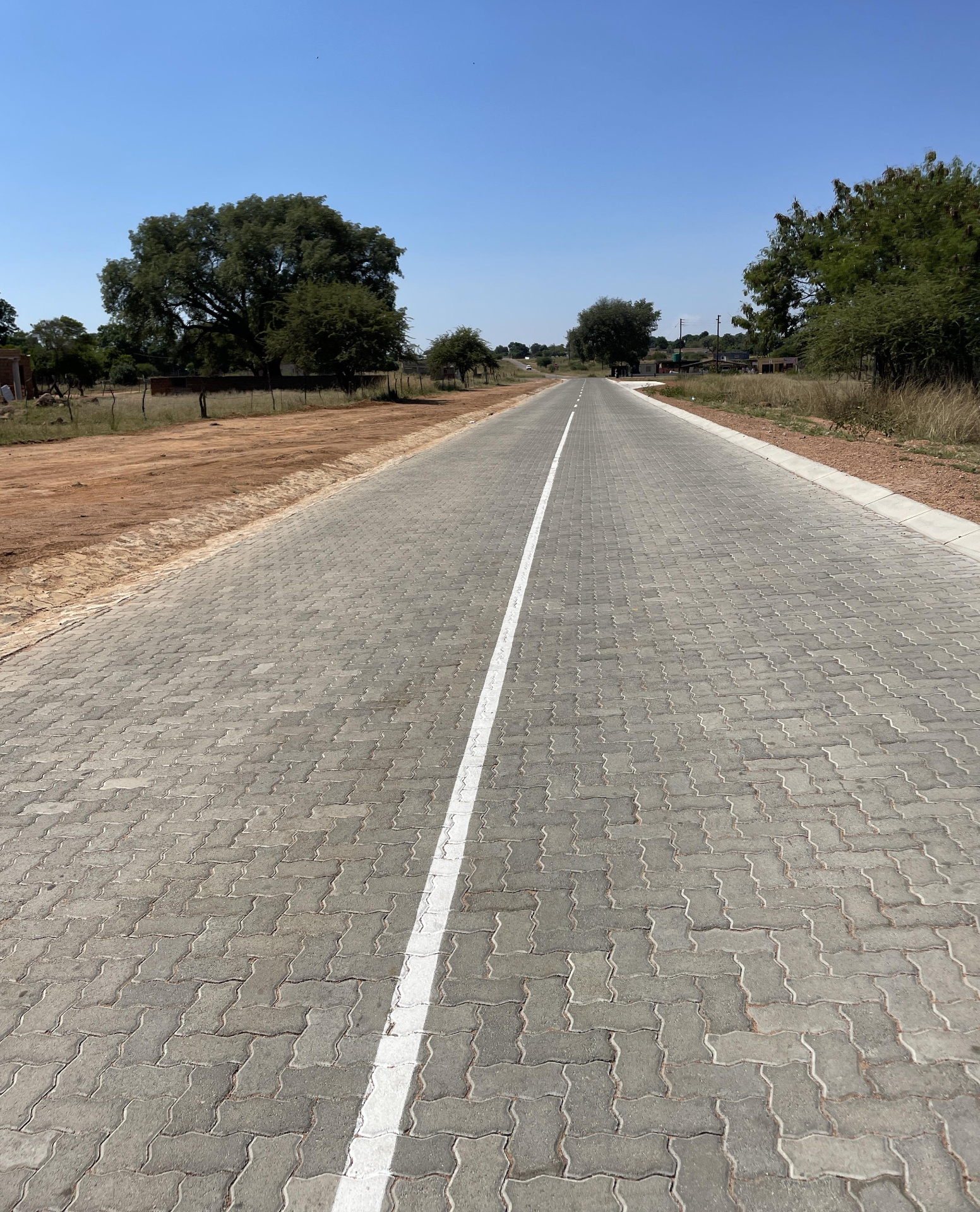 Completed concrete block paved road with centre line marking